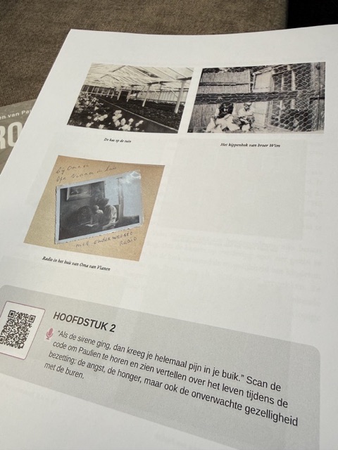 Printed biography page with photos and a QR code